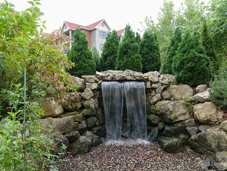 Stone water fountain in a garden